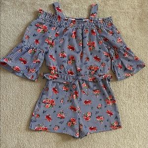 Girls romper with flowers. Size girls large.